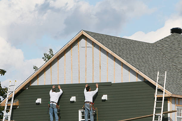 Professional Siding Contractor technician working in Burlington, MA